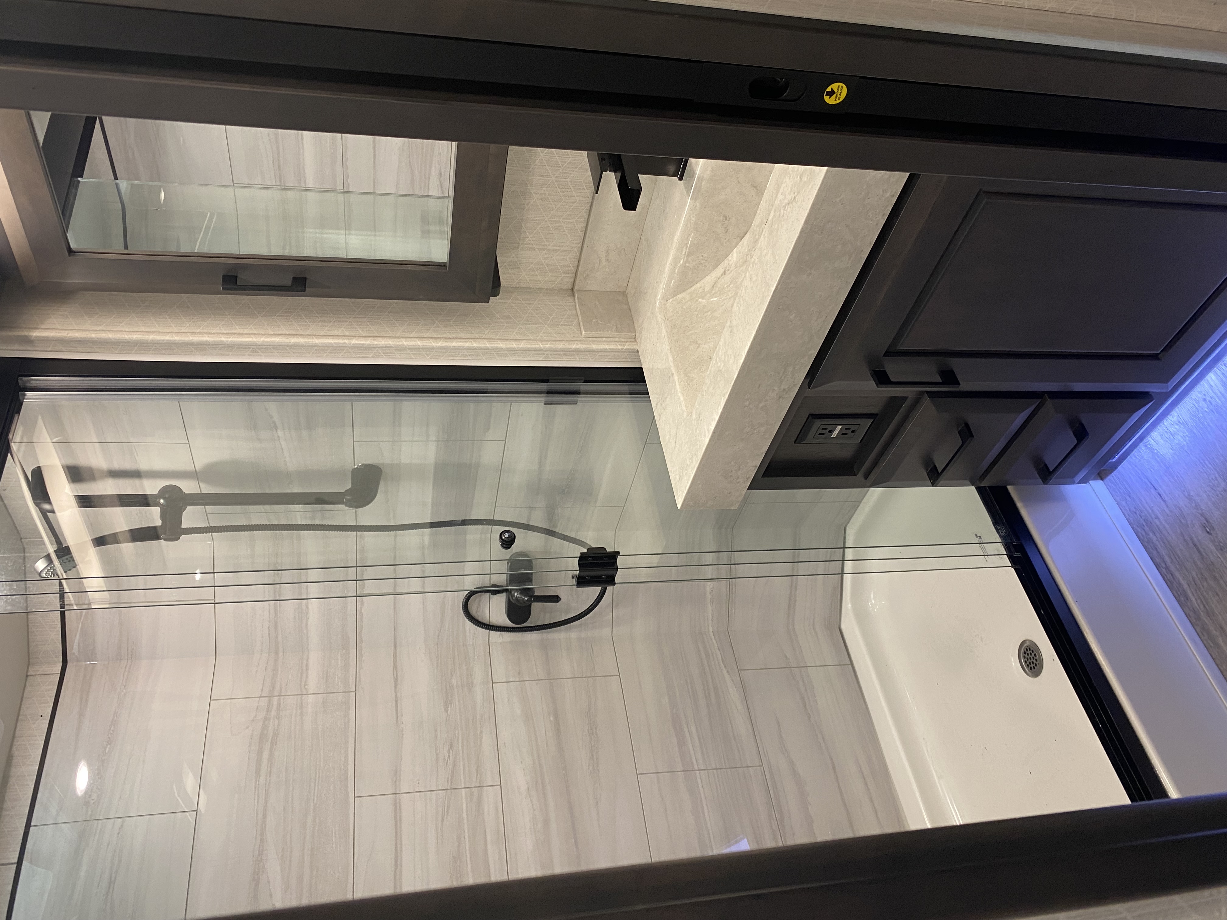 Premium wood and stone finishes throughout the RV interior