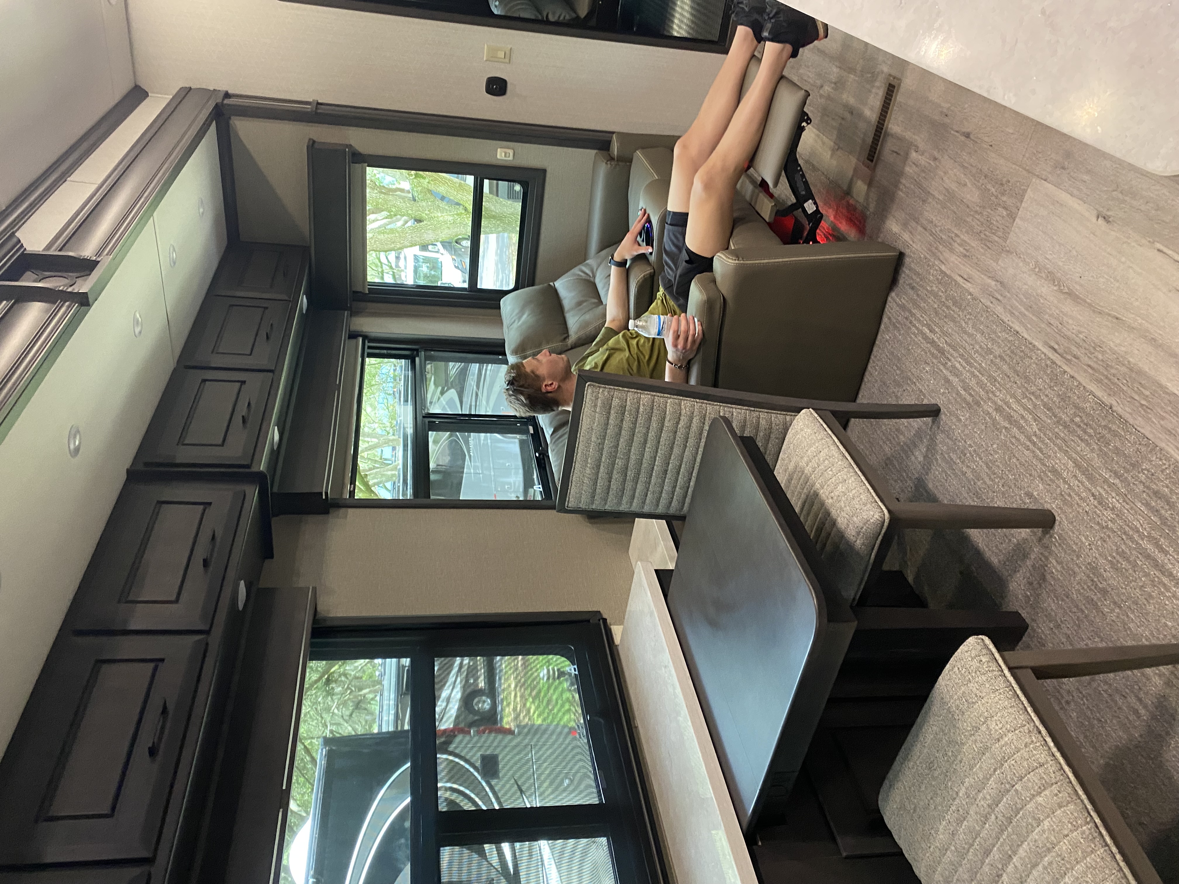 Spacious living area with dinette and recliners